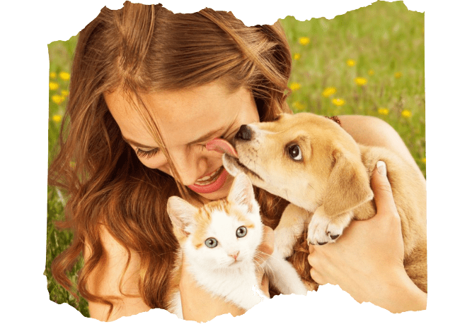 mujer abrazando a un perro y gato